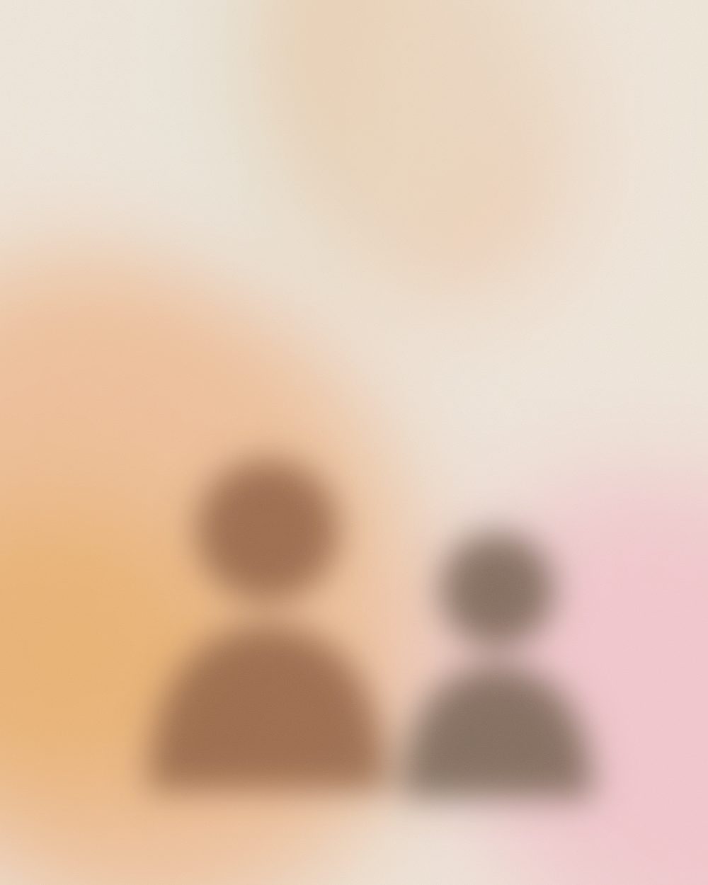 An older person and a younger family member sitting together, talking
